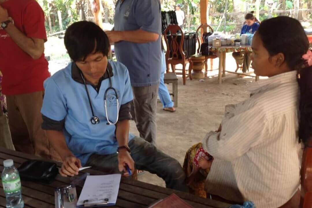 Tinak attending to a patient.
